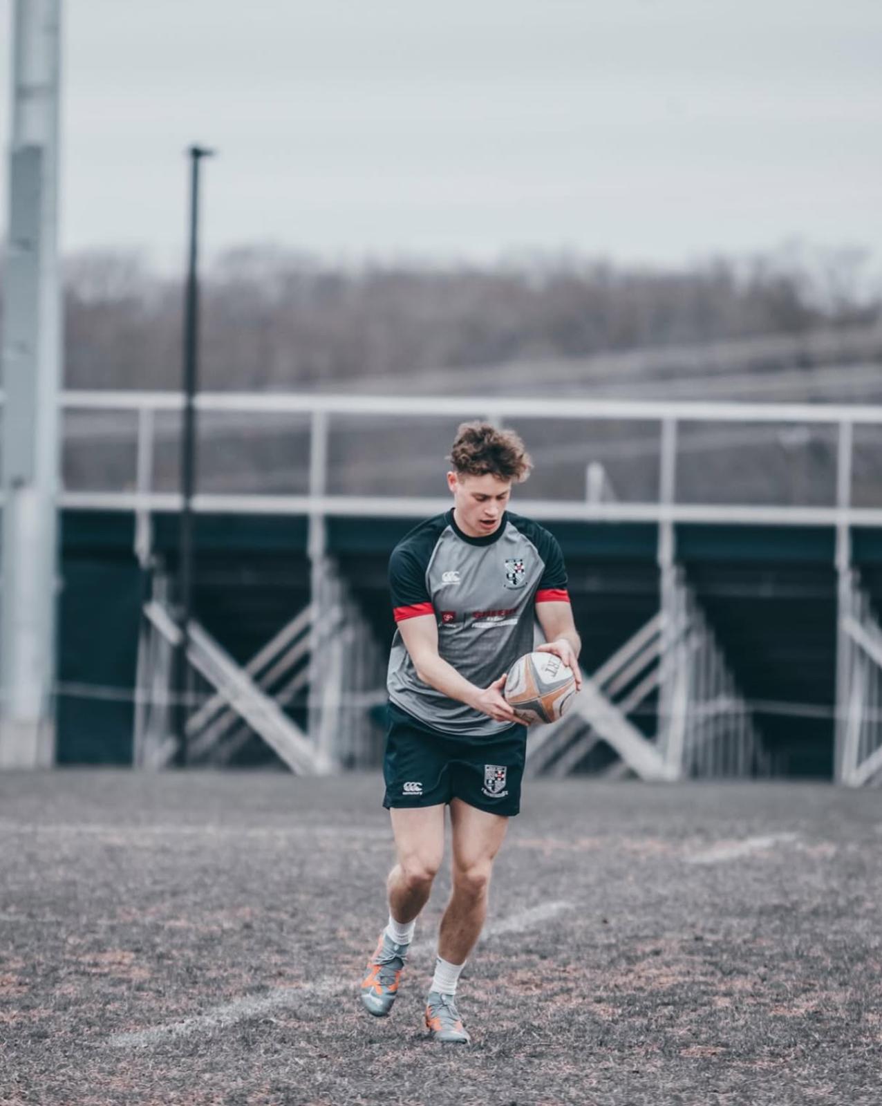 Max McCusker on the pitch in training kit